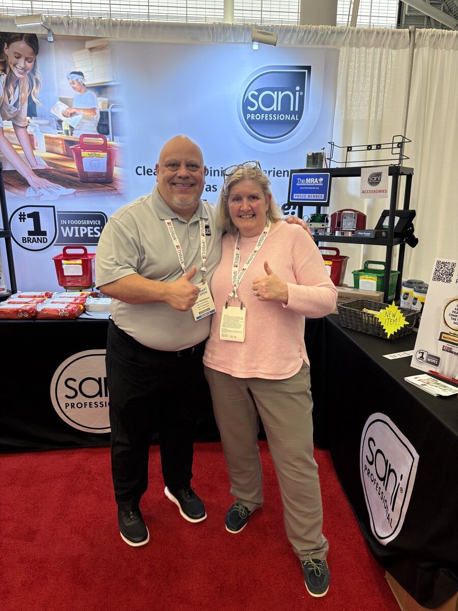 Donna and Leslie at food service trade show with professional equipment